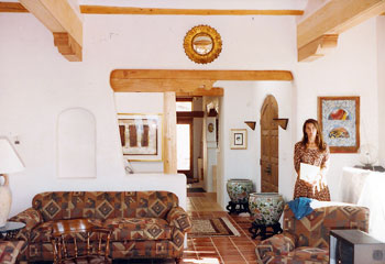 exposed wood beams in natural adobe residence