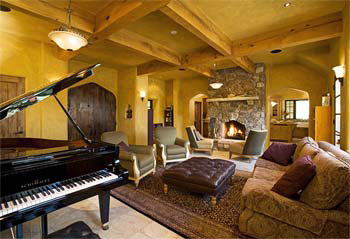 exposed wood trusses in straw bale home