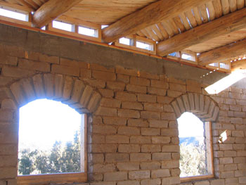 exposed adobe arched windows
